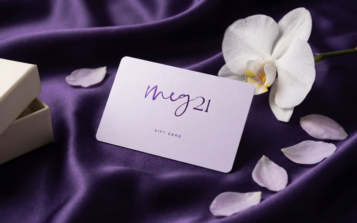 MEG 21 Gift Card on violet silk with a white orchid